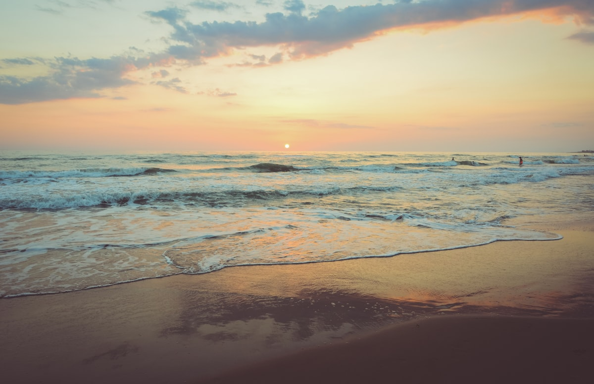 Golden hour light over a calm beach on the Space Coast of Florida