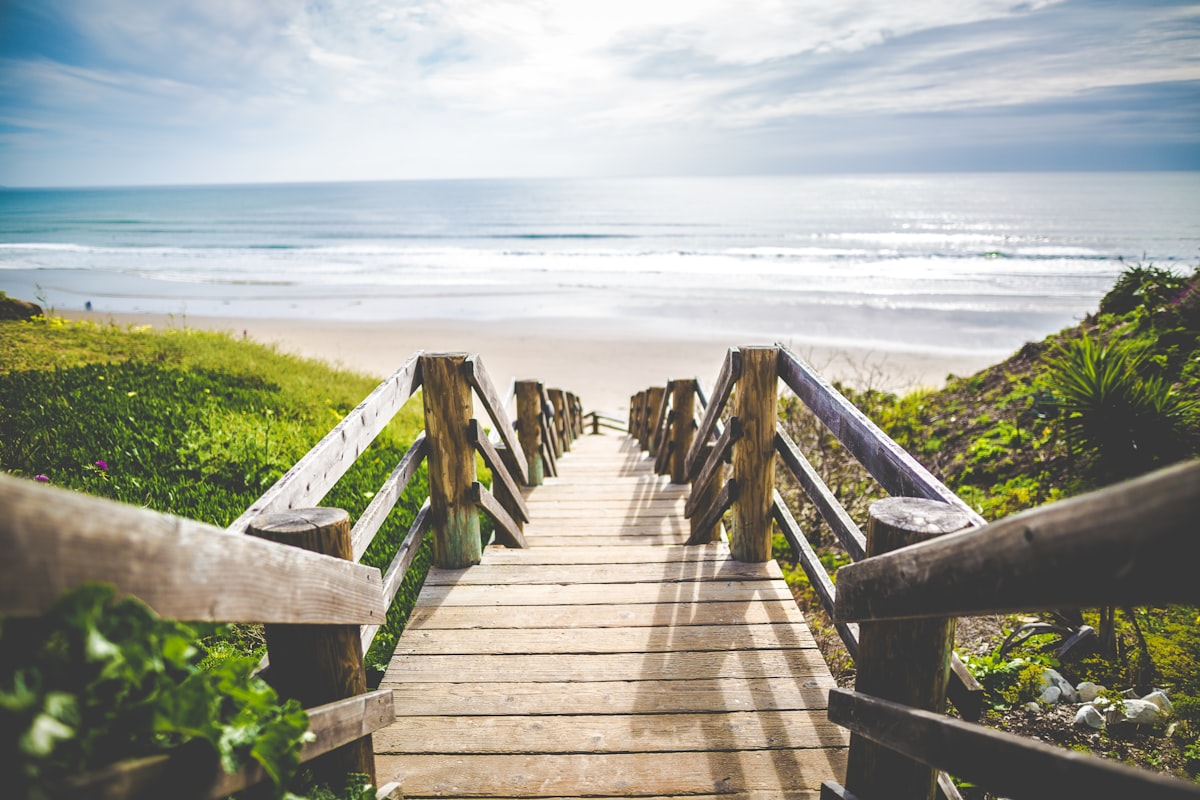 A wooden boardwalk leading down to the beach on the Space Coast